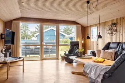 a living room with a couch and a table at 533-Thisted-Fiskervej-153 in Thisted