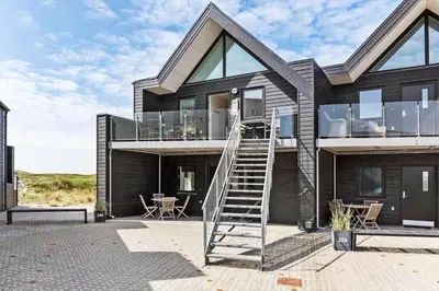 a house with a spiral staircase in front of it at 556-Thisted-Havstokken-24-A in Thisted