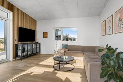 a living room with a couch and a tv at 109-Thisted-Lyngbakken-9 in Thisted