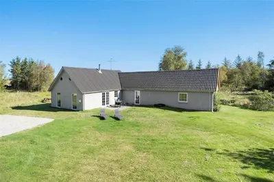 a house with two chairs in front of it at 517-Thisted-Sigvej-10 in Thisted