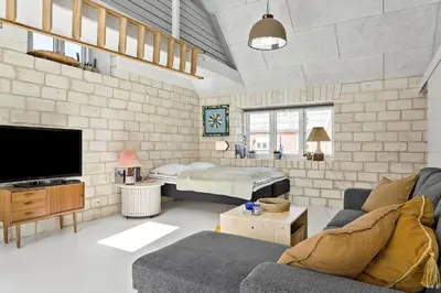 a living room with a couch and a tv at 758-Vestervig-Vesterhavsvej-28 in Vestervig