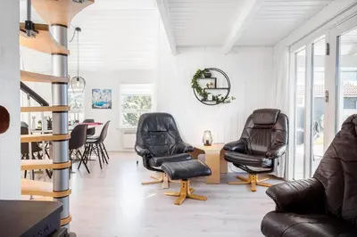 a living room with leather chairs and a table at 144-Thisted-Nordsovej-204-D in Thisted