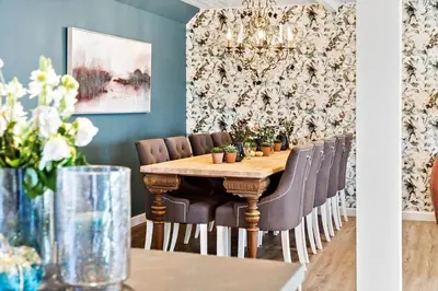 a dining room table with chairs and a chandelier at 194-Vestervig-Vesterhavsvej-7-C in Vestervig