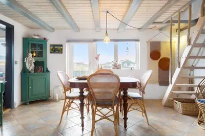 a dining room with a table and chairs at 1012-Thisted-Trindbak-12-B in Torsted