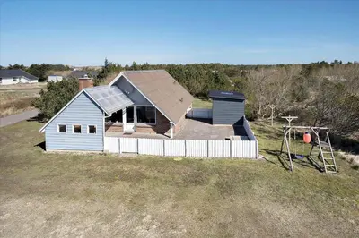 a house with a roof on top of a field at 716-Thisted-Kristinesvej-34 in Thisted