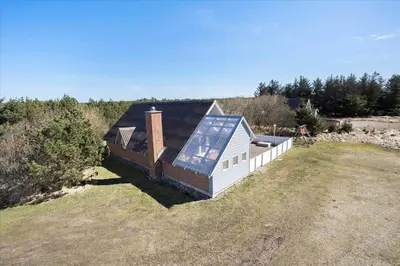 a small house with a solar roof on a field at 716-Thisted-Kristinesvej-34 in Thisted