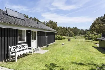 a house with a yard next to a house at 344-Thisted-Flyndervej-20 in Thisted