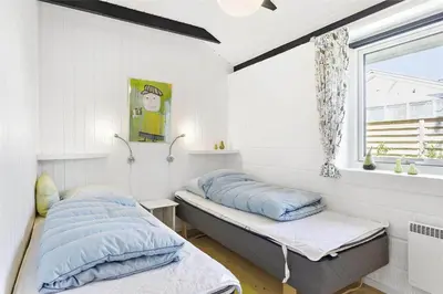 a bedroom with two beds and a window at 344-Thisted-Flyndervej-20 in Thisted