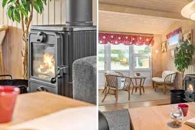 a living room with a wood stove and a table at 860-Thisted-Gronnevej-6 in Thisted