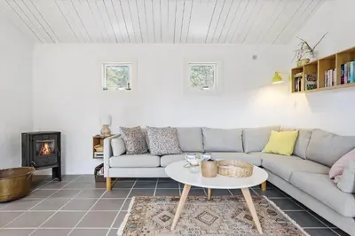a living room with a couch and a table at 1309-Thisted-Blabaervej-2 in Thisted