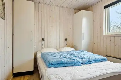 a large bed in a room with a window at 1322-Snedsted-Lykkens-Hab-21 in Snedsted