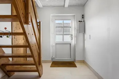 a hallway with a door and stairs in a room at 1329-Thisted-Nordsovej-226 in Thisted