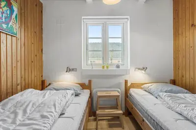 two beds in a room with a window at 1329-Thisted-Nordsovej-226 in Thisted