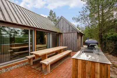 a backyard with a picnic table and a grill at 1061-Thisted-Spanggardsvej-85-B in Torsted