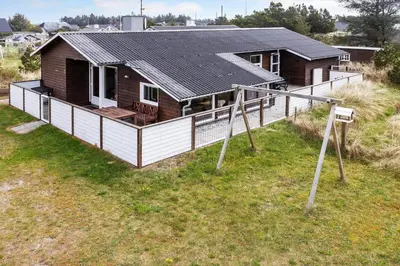a house with a large deck in a field at 1341-Thisted-Mose-Bolle-Vej-5 in Thisted