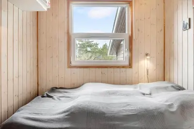 a white bed in a room with a window at 1341-Thisted-Mose-Bolle-Vej-5 in Thisted