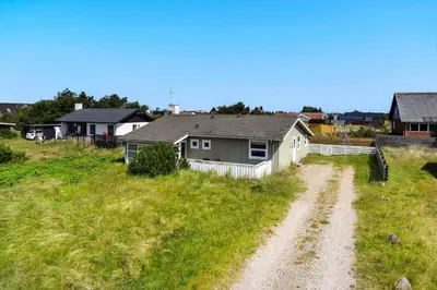 a house in a field with a dirt road at 1339-Thisted-Aerenprisvej-5 in Thisted