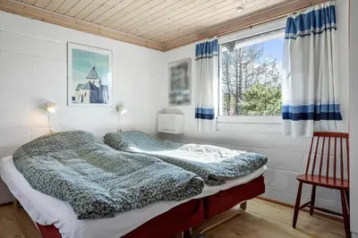 a bedroom with a bed and a window at 246-Thisted-Pighvarvej-16 in Thisted