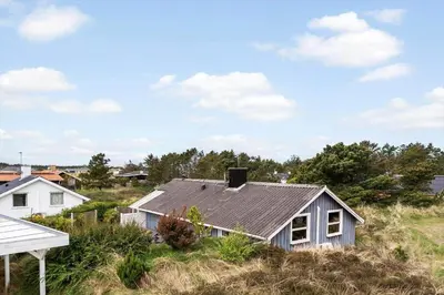 a house with a tin roof on a field at 1342-Thisted-Mose-Bolle-Vej-8 in Thisted