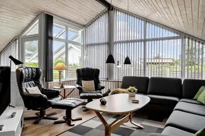 a living room with a couch and chairs and a table at 1342-Thisted-Mose-Bolle-Vej-8 in Thisted