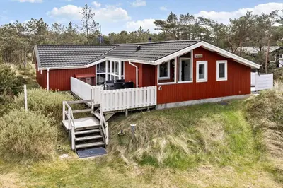a red house with a staircase in front of it at 1326-Thisted-Blabaervej-6 in Thisted