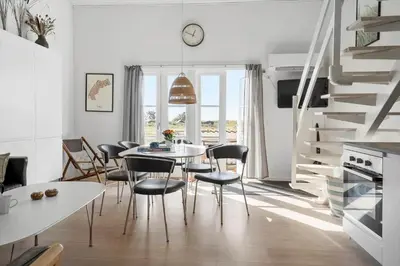 a kitchen and dining room with a table and chairs at 1346-Vestervig-Havnevej-1-lejl-15 in Vestervig