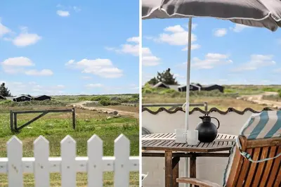 a table with an umbrella and a table with a fence at 1346-Vestervig-Havnevej-1-lejl-15 in Vestervig
