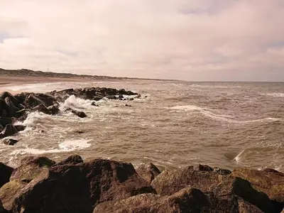 a view of the ocean from a rocky beach at Holiday home for family in Denmark in Løgsted