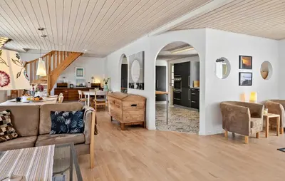 a living room with a couch and a table at 4 Bedroom Nice Home In Bedsted Thy in Bedsted Thy