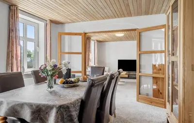 a dining room with a table and chairs at Lovely Home In Thyholm With Wifi in Thyholm