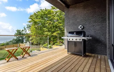 a outdoor kitchen with a stove on a deck at Awesome Home In Spøttrup With Wifi in Spottrup