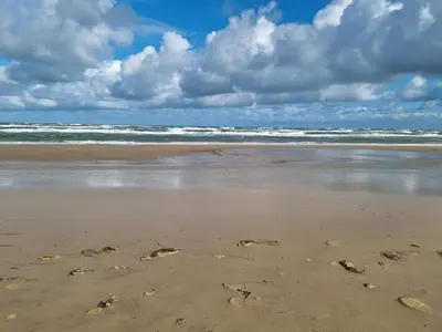 an image of footprints in the sand on a beach at 12 person holiday home in Pandrup-By Traum in Pandrup