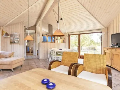 a kitchen and living room with a table and chairs at 8 person holiday home in Fjerritslev-By Traum in Fjerritslev