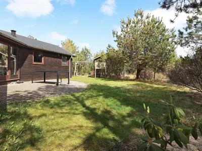 a house with a yard with a basketball hoop at 8 person holiday home in Fjerritslev-By Traum in Fjerritslev