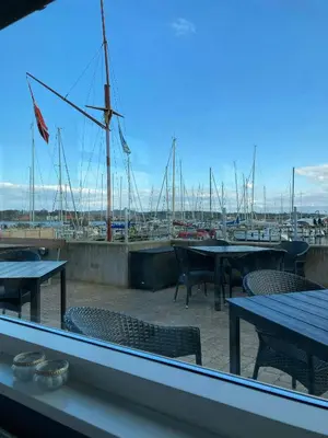 a view of a marina with tables and chairs at Family Cabin By The Calm Waters Of Limfjord in Højslev