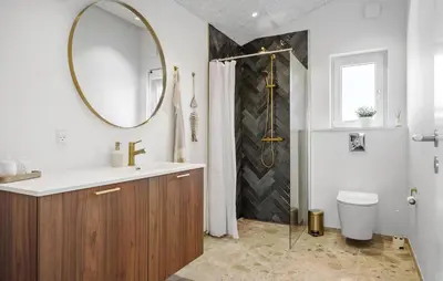 a bathroom with a sink and a mirror and a shower at Gorgeous Home In Saltum With Wifi in Saltum
