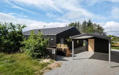 a black house with a black roof at Gorgeous Home In Saltum With Wifi in Saltum