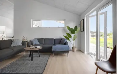 a living room with a couch and a table at Gorgeous Home In Saltum With Wifi in Saltum