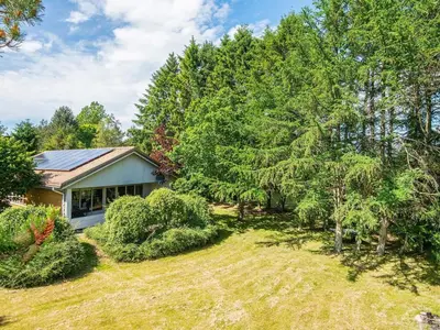 an image of a house with trees and a yard at 6 person holiday home in Højslev-By Traum in Højslev