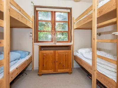 a bedroom with two bunk beds and a window at 6 person holiday home in Højslev-By Traum in Højslev