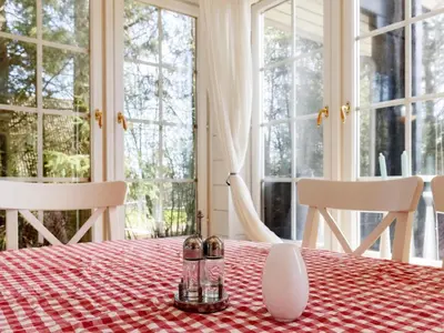 a table with a red and white checkered table cloth at 7 person holiday home in Løgstør-By Traum in Løgstør