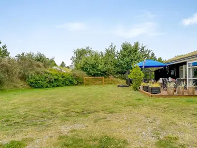 a yard with a soccer ball and a goal at Holiday Home Selvi - 2-2km from the sea by Interhome in Blokhus