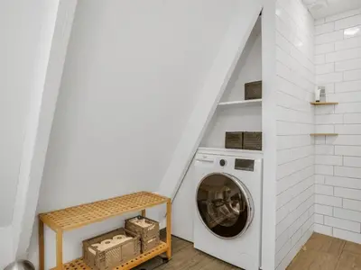 a laundry room with a washer and dryer at Holiday Home Ernstine by Interhome in Farsø