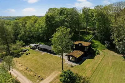 an aerial view of a house in the middle of a field at Summer House Close To Nature By The Limfjord in Nykøbing Mors