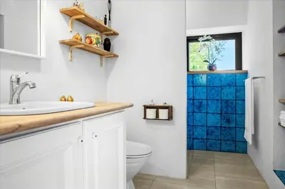 a bathroom with a toilet and a sink at Summer House Close To Nature By The Limfjord in Nykøbing Mors
