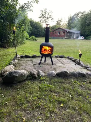 a fire pit in the middle of a yard at Ålevænget 1 in Gedsted