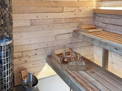 a sauna with a sink in a wooden wall at 10 person holiday home in Vinderup-By Traum in Vinderup