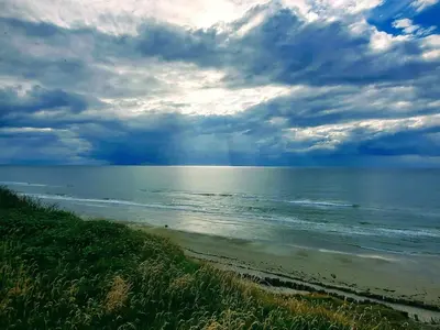 a view of the ocean under a cloudy sky at 6 person holiday home in Løkken-By Traum in Løkken