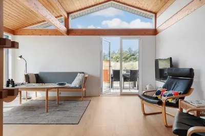 a living room with a couch and a table at LK2113-Lokken-Kettrup-Bjerge-vej-67 in Løkken