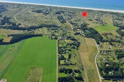 a red balloon flying over a park with a red circle at LK1427-Lokken-Nannasvej-26 in Løkken